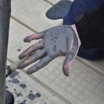 Thick gray ash wiped off a log from the Dan River collected on Amy Adams' hand during water testing.