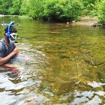 Boy snorkeling in Conasauga River