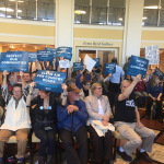 People holding signs at the Sierra Club's Hearing for Healthy Communities