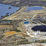 Aerial view of coal ash ponds near river