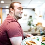 man holding food