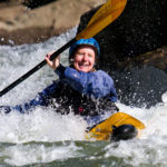 Chrissy paddles through whitewater