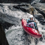 Emily paddles down a rapid