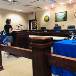 woman testifies at public hearing