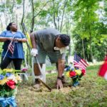 family tends to cemetery