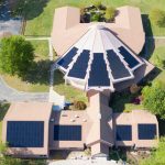 aerial view of a church with solar panels