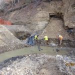 workers cleaning up mine site