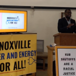 Rev. Calvin Skinner speaks at a podium