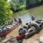 canoes full of tires