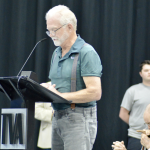 man speaks into microphone at TVA Board listening session