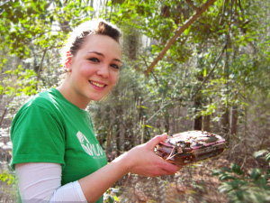 Space cadet holds up treasured cache. Photo by Map Man